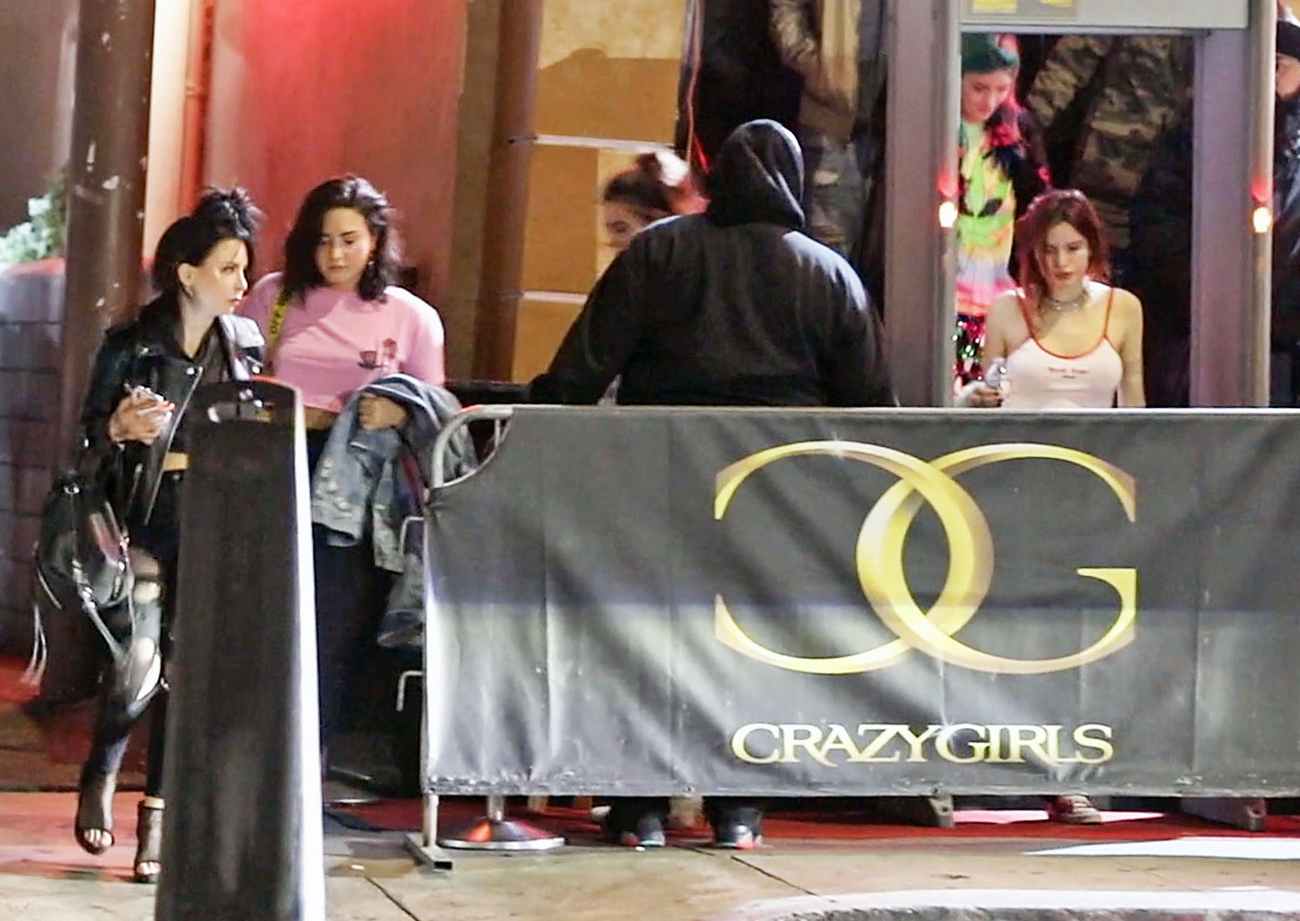 Demi_Lovato___Bella_Thorne_-_Leaving_Crazy_Girls_Strip_Club_together_in_Hollywood2C_CA_-_April_1800003.jpg